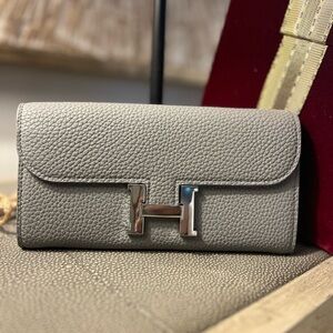 Gray Leather Wallet with Metallic Clasp and Flap Closure